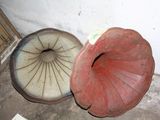 a red and white object on the floor next to a brown object
