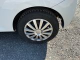a white car parked on the side of the road