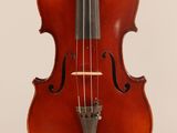 an old violin with a bow hanging from it ' s neck