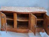 a wooden cabinet with a marble top and doors open