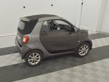 a small car that is parked in a garage