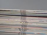 a lot of magazines stacked on top of each other