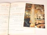 an open book with a picture of the interior of a building