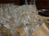 a lot of empty wine glasses on a table