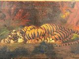 tableau représentant deux tigres se reposant au sol dans une zone boisée