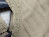 a close up of a pair of pants with a pair of scissors sticking out of it