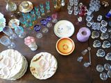 a wooden table with a lot of glassware on it