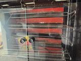 a glass display case with a bunch of items inside of it