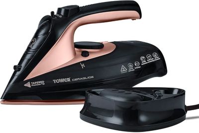 an image of a black and pink steam iron on a white background