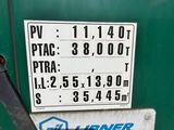 a gas station sign on the back of a green truck