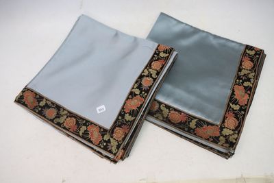 two pieces of cloth with a pattern on them sitting on top of a table