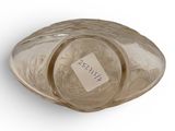 a glass bowl with a label on it on a white surface