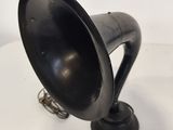 a black lamp that is sitting on a white table