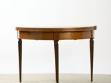the table is made of wood and has a curved top