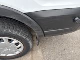 a close up of a car tire on the street
