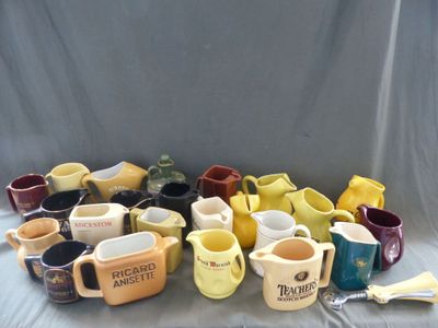 many different types of mugs and spoons on the table