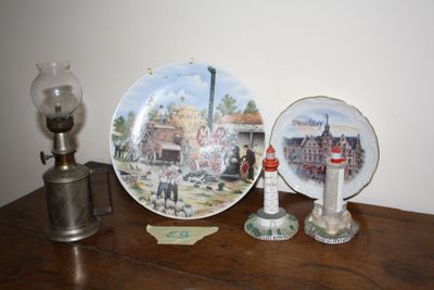 two plates on a table with a lamp on it