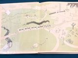an open book with a drawing of a train on it