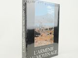 a book with a picture of a mountain in the background