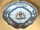 a plate with a picture of a lion and a lion on it