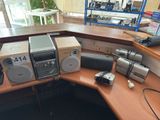 a desk with a lot of electronics on top of it