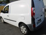 a white van that is parked in a parking lot
