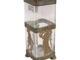 a glass box with a gold design on it