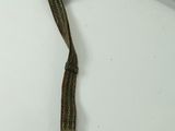 a small metal object with a rope attached to it