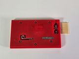 an image of a red electronic device on a white surface