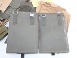 two pieces of luggage sitting on top of a table