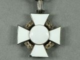 an image of a medal with a cross on it on a red ribbon