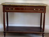 a wooden table with a glass top on it