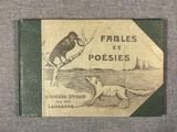 an old book with a picture of a bird and a dog on it