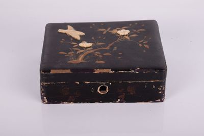 a small black box with birds and flowers on it
