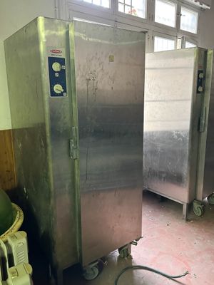 a picture of a commercial stainless steel refrigerator in a kitchen