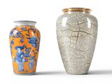 two vases sitting next to each other on a white surface