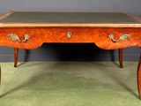 an antique desk with a marble top and two drawers