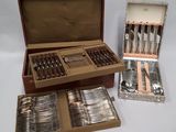 a lot of silverware in a box on a table