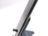 a close up of a cell phone on a stand