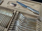 a box with a bunch of silverware in it