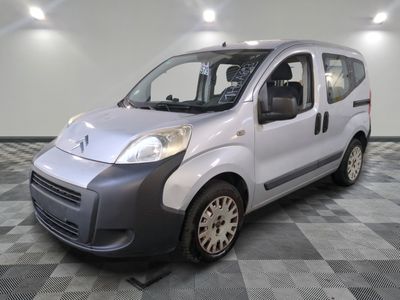 a picture of a silver van on a checkered floor
