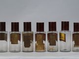 six bottles of different types of perfume sitting next to each other