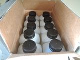 bottles of milk in a cardboard box filled with milk