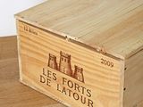 a wooden box with a label on it sitting on a table