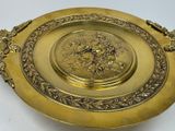 a gold plate with a design on it on a table