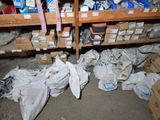 many boxes and bags of items on the shelves