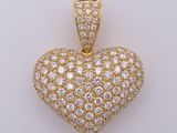 a diamond heart pendant on a white background