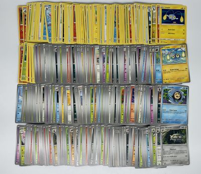 a lot of pokemon cards on the table together
