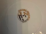 a close up of a plate with a logo on it