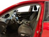 the interior of a red car with the door open and the driver ' s seat down